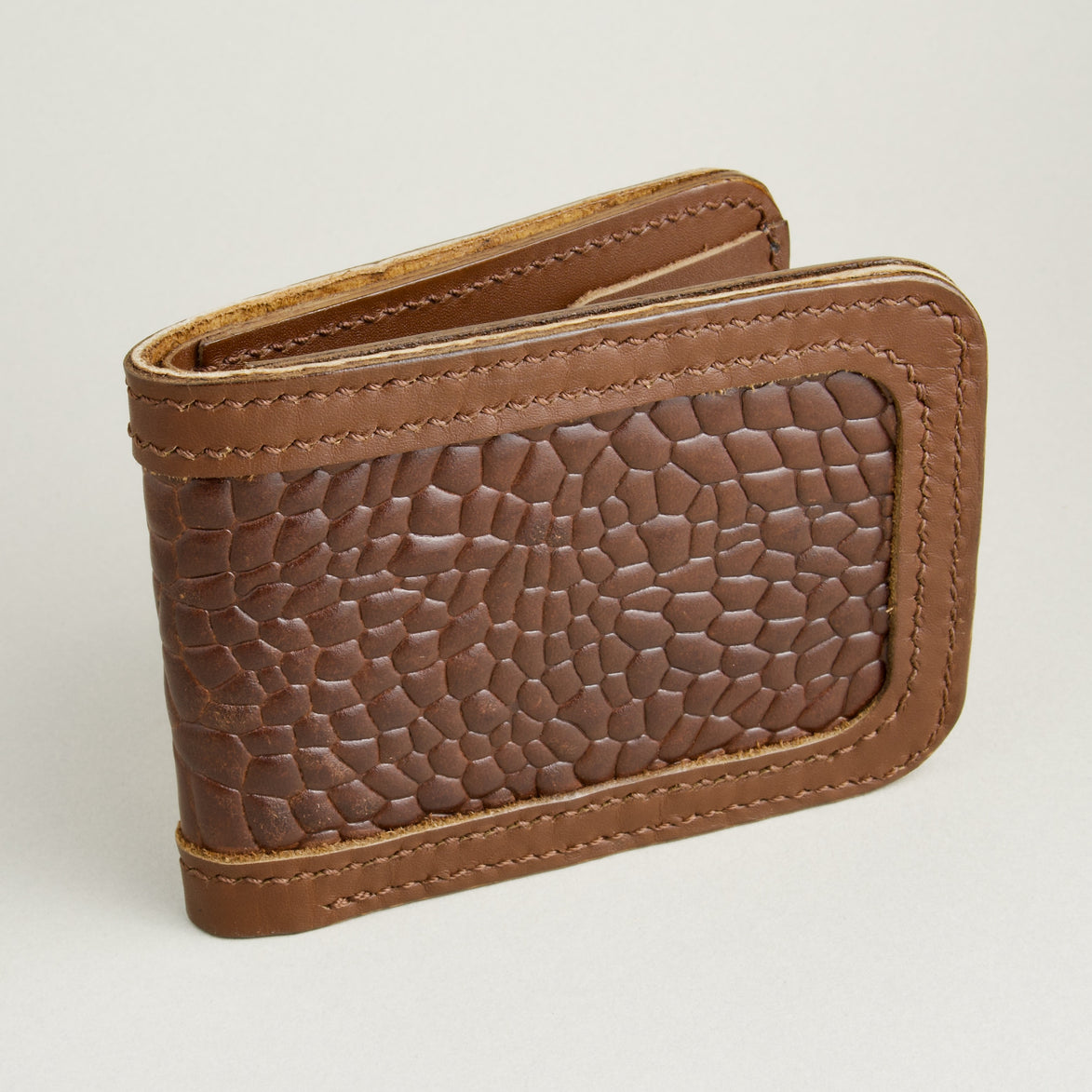 Side view of espresso brown croc-embossed full-grain leather bifold wallet featuring handmade stitching. Markore Indus Sultan