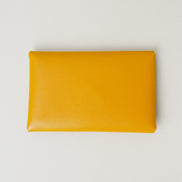 Back view of full grain leather envelope style wallet in amber. Markore Niva Seal.