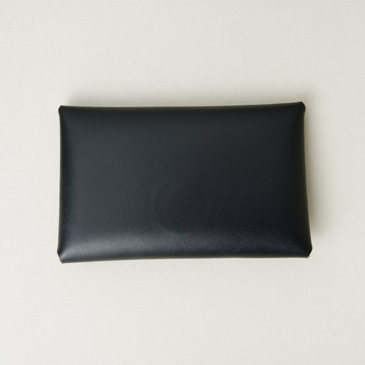 Back view of full grain leather envelope style wallet in midnight black. Markore Niva Seal.