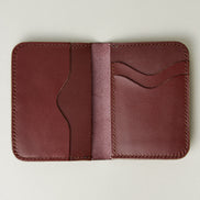 Interior view of espresso brown full-grain leather wallet featuring card slots and handmade stitching. Markore Ravi Slip.
