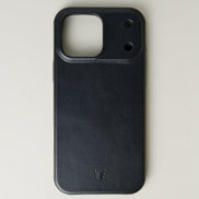 Outside view of midnight black leather iPhone 17 cover showing embossed brand logo. Markore Shell Guard.